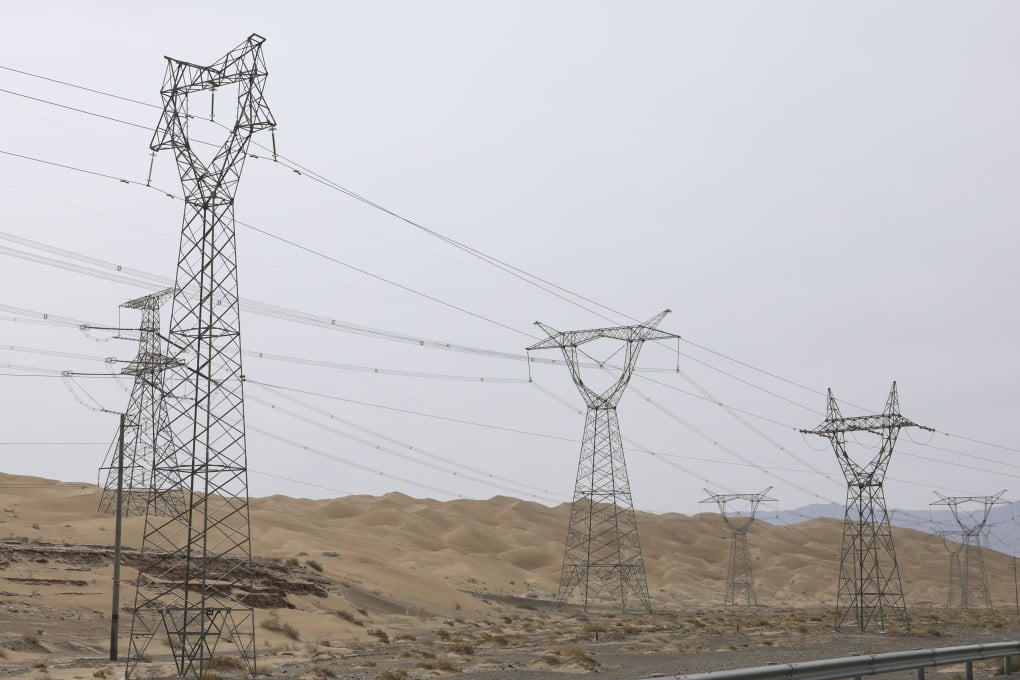 High-voltage transmission towers and power lines in Dunhuang, China on June 1. Photo: Zhe Ji