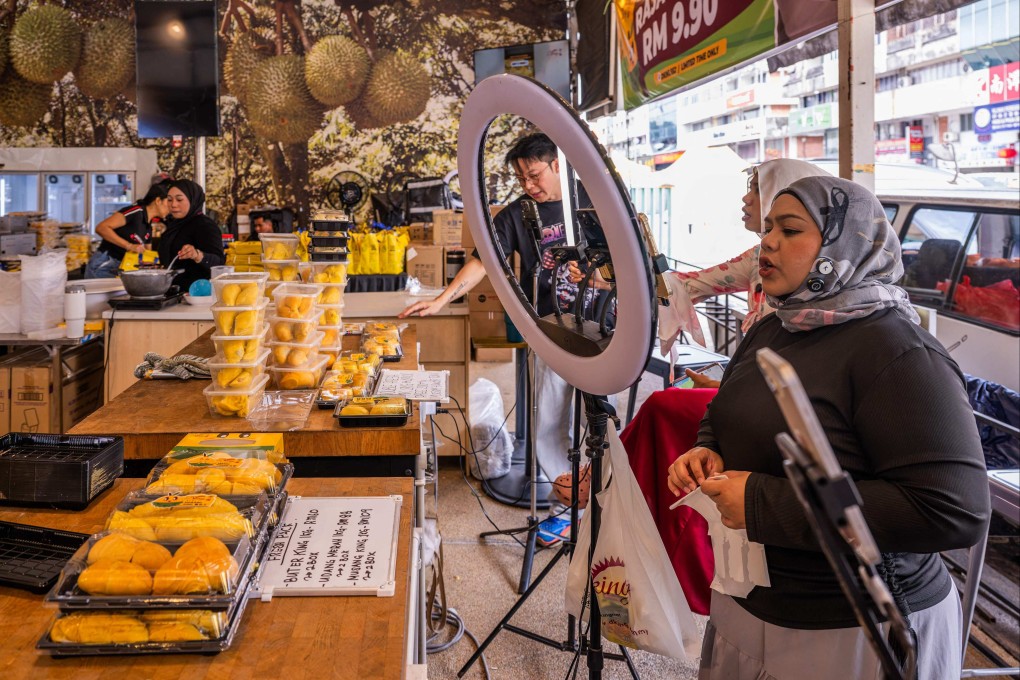 Live streamers sell durians through an online platform at a shop in Kuala Lumpur, Malaysia, last month. Photo: AFP
