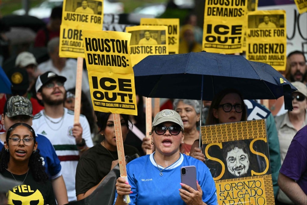 Demonstrators hold signs during an anti-ICE protest in Houston, Texas, on Saturday. Photo: AFP