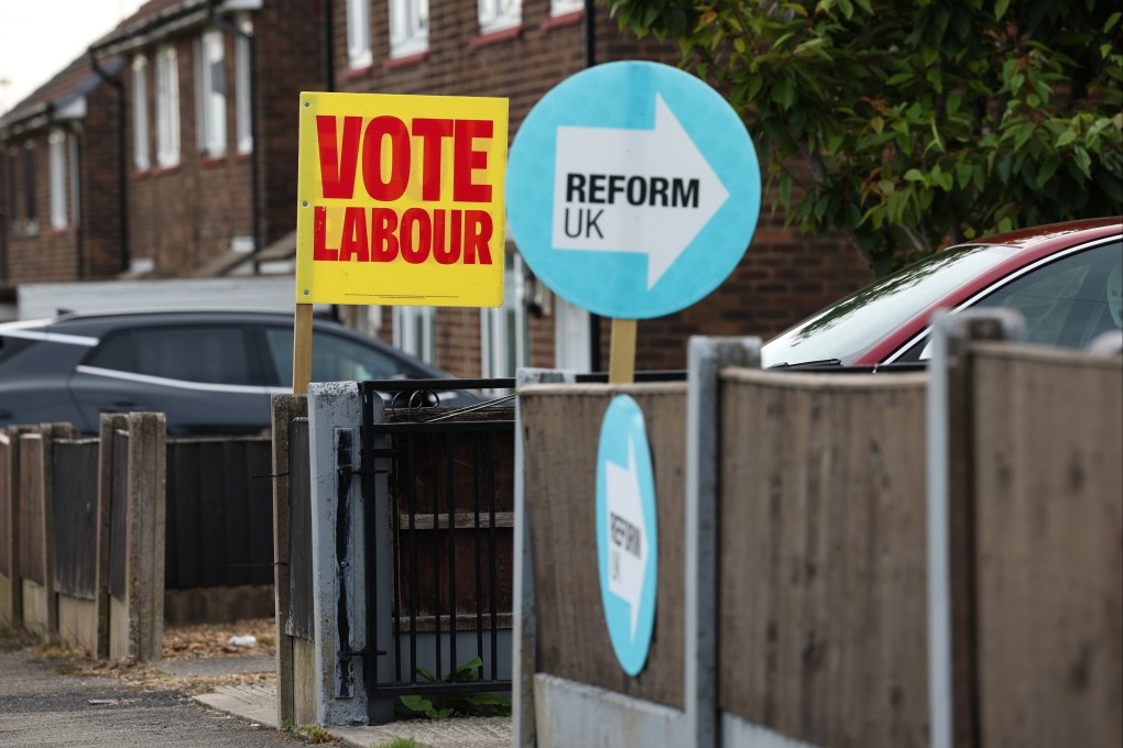 Placards for the Labour party and Reform UK on display outside houses in Wigan, Britain, on June 15. Photo: EPA