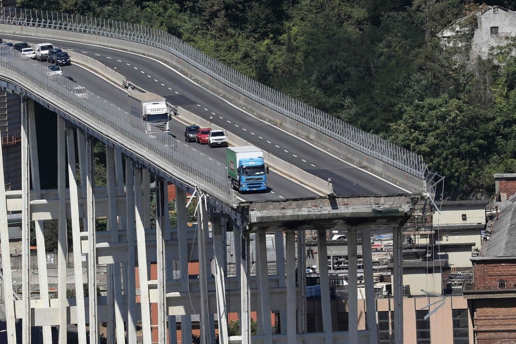 Vehicles are abandoned on the Morandi motorway bridge after a section collapsed in the north-western Italian city of Genoa in August 2018. Photo: AFP