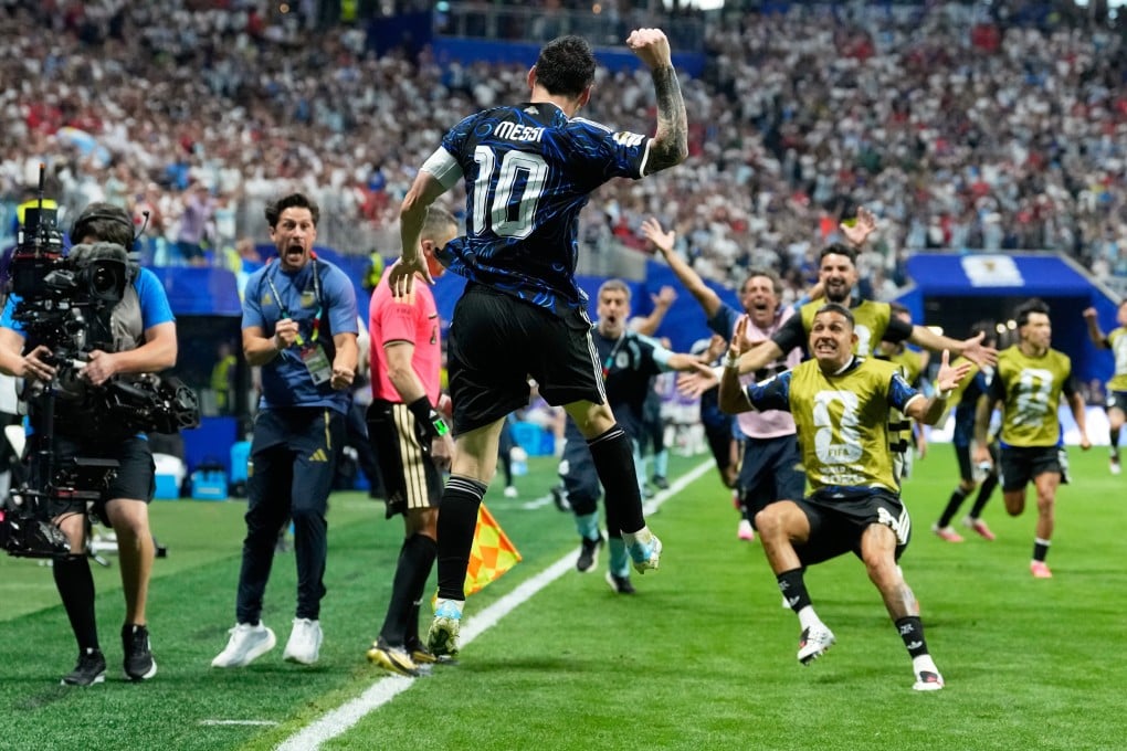 Argentina’s Lionel Messi celebrates after teammate Lautaro Martinez scores the winner. Photo: AP