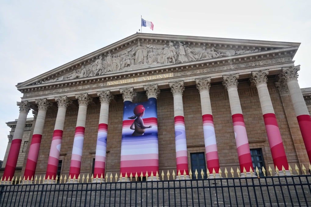 The French National Assembly is draped with the artwork “Marianne Dreams” by French street artist Seth before lawmakers vote on an assisted-dying bill in Paris on Wednesday. Photo: AP