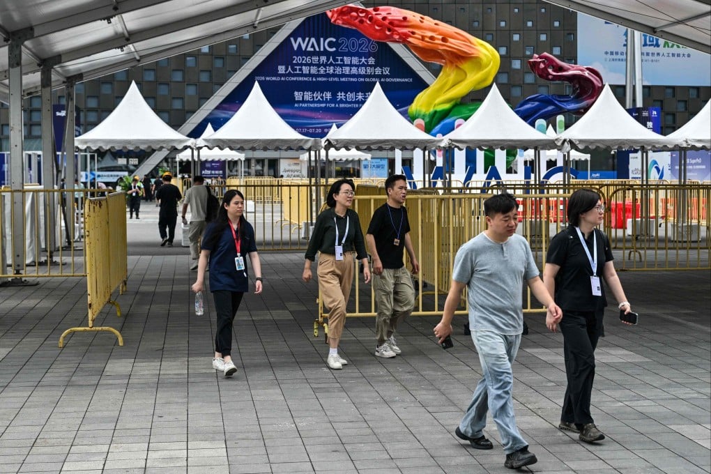 People walk near the entrance of the the Shanghai World Expo Exhibition and Convention Center, venue for the World Artificial Intelligence Conference, in Shanghai on July 16. Photo: AFP
