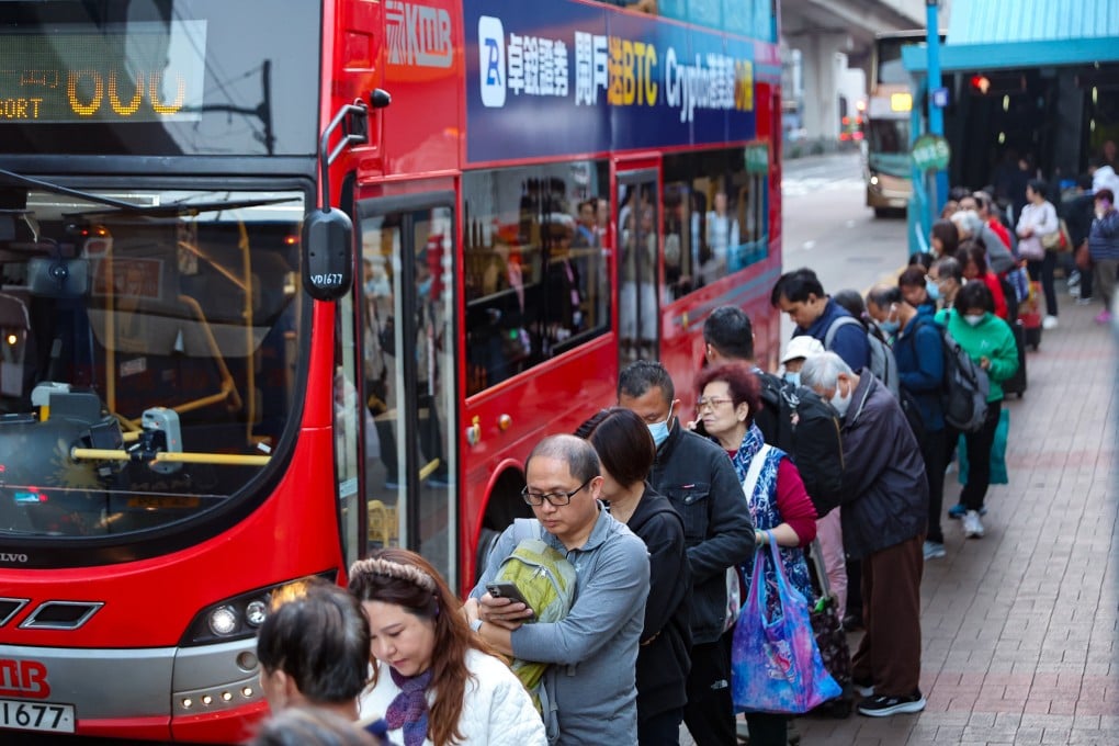 People wait at a bus stop in Kwun Tong. Photo: Edmond So