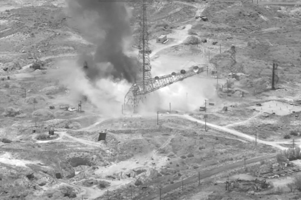 Smoke rises from an explosion at an unknown location, during what US Central Command says are strikes on Iran. Image: US CENTCOM via Reuters