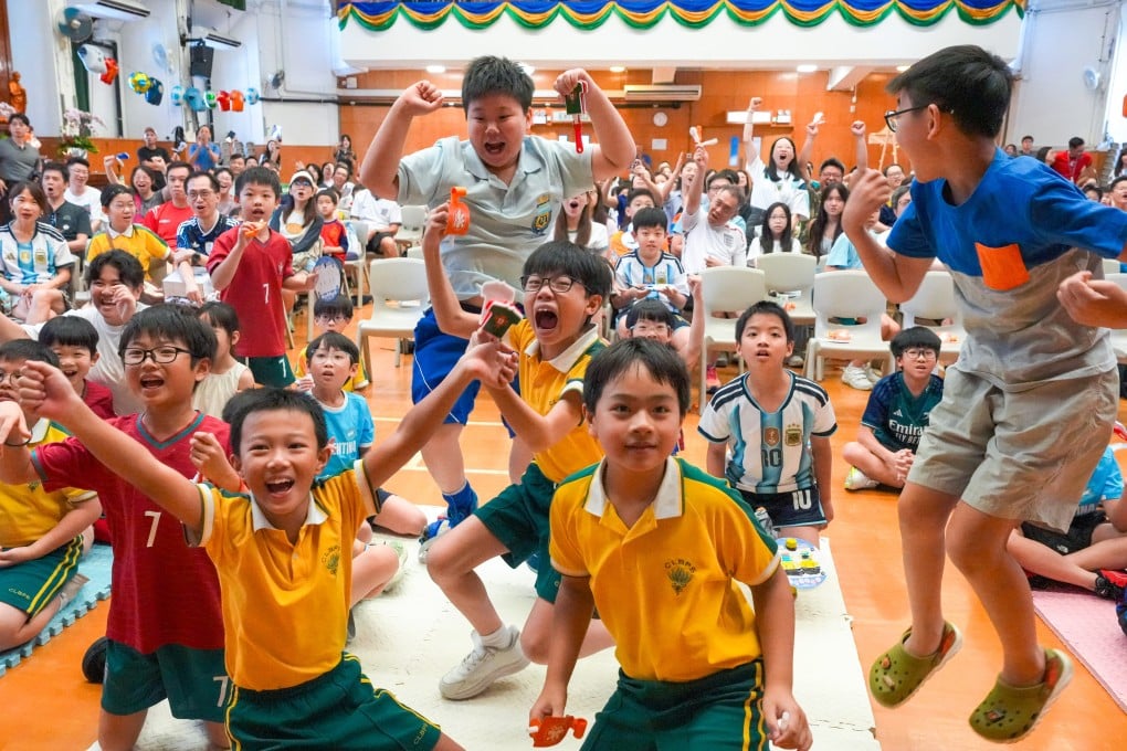 Buddhist Chi Lin Primary School’s “World Cup Round of 16 Family Fun Day” in Tseung Kwan O, Hong Kong, on July 12, with students and their parents cheering for their favourite team during the Argentina vs Switzerland game. Photo: Dickson Lee