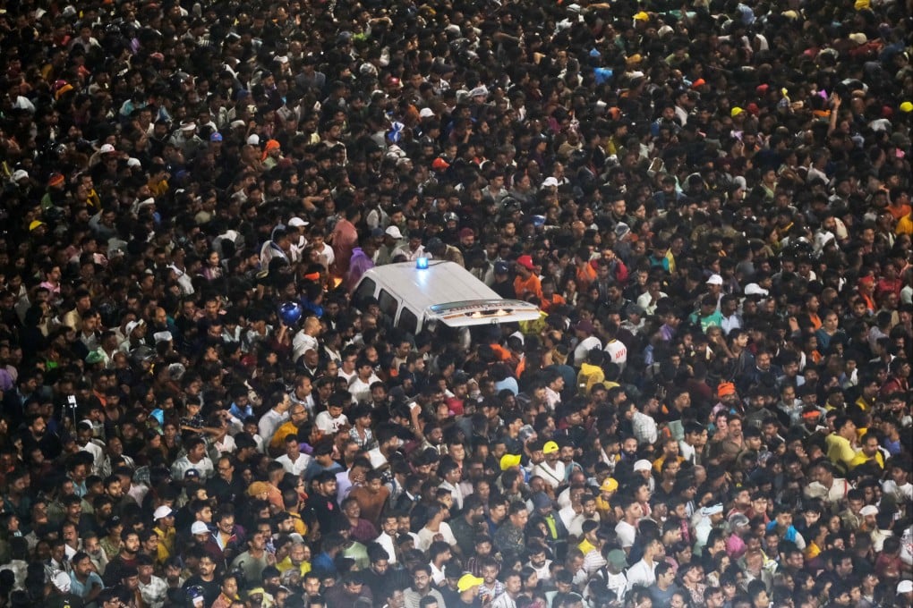 An ambulance is surrounded by pilgrims during the annual Hindu chariot procession in Puri, India, on Thursday,. Photo: AP