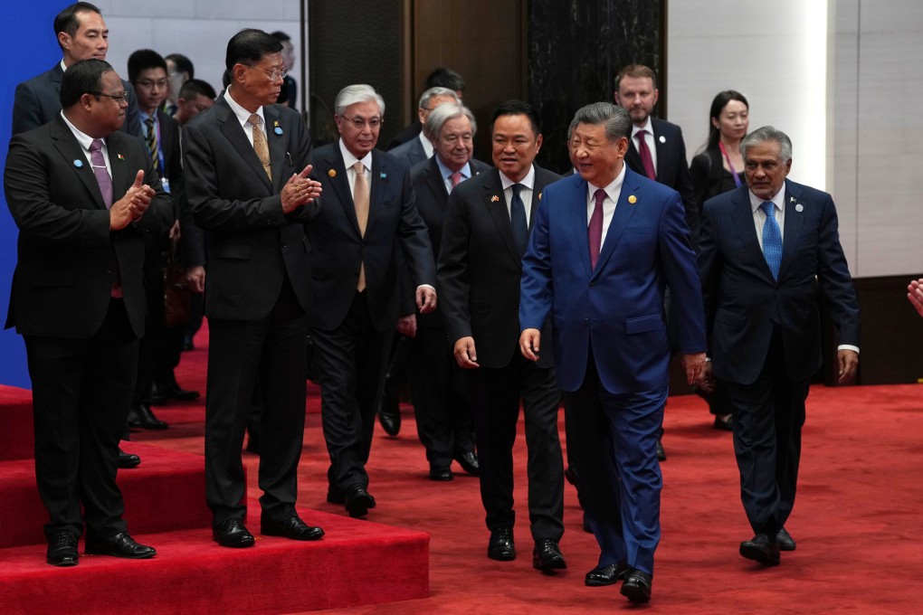 Chinese President Xi Jinping arrives for a group photo with other attendees before the opening ceremony for the World AI Conference in Shanghai on Friday. Photo: AP