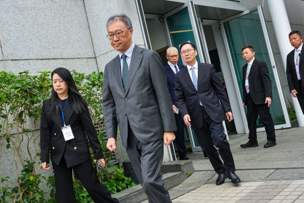 Justice David Lok (centre), leading the independent committee to investigate the Tai Po blaze. Photo: Karma Lo