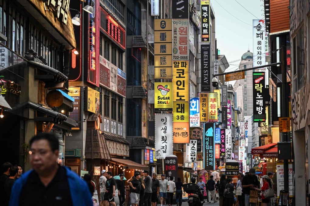 People walk through a food alley in Seoul, South Korea, on June 27. Photo: AFP
