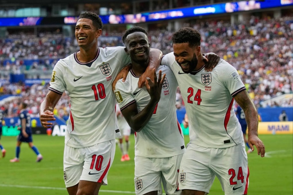 England’s Bukayo Saka (centre) celebrates his hat-trick alongside Jude Bellingham (left) and Reece James. Photo: AP