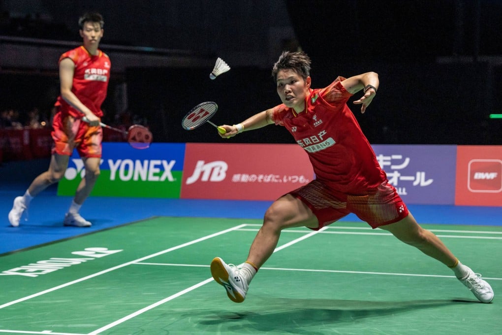 Chinas Huang Dongping (right) and Feng Yanzhe said making fewer errors had given them the win. Photo: AFP