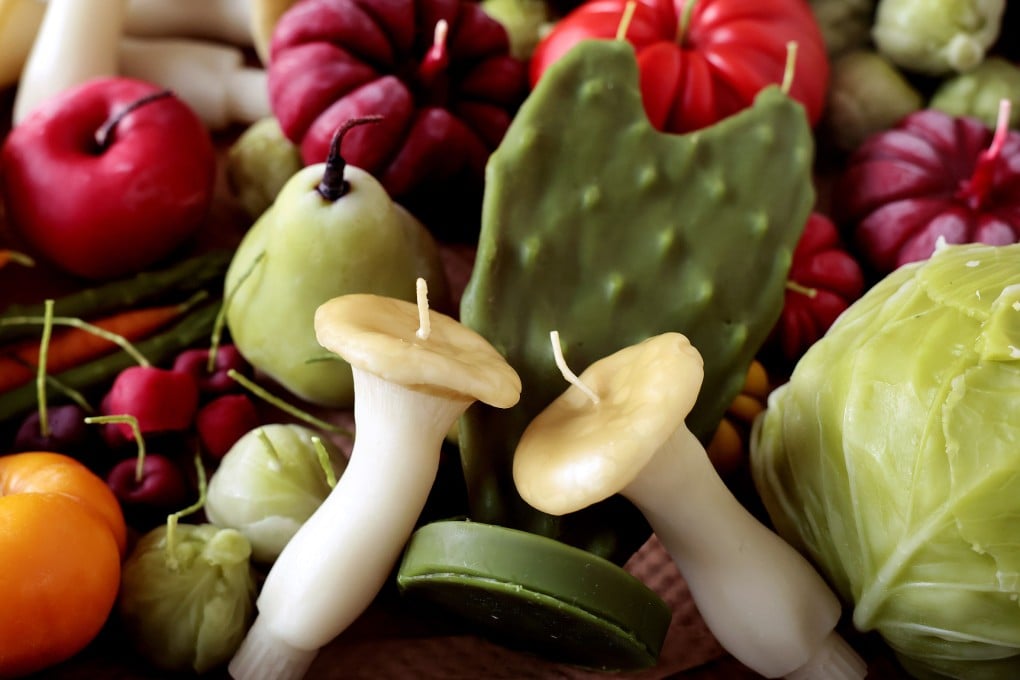 A variety of beeswax candles shaped like fruit and vegetable at Happy Organics’ studio in Los Angeles. The candle collection is a homage by Jessica Gonzalez to her family’s produce company. Photo: TNS