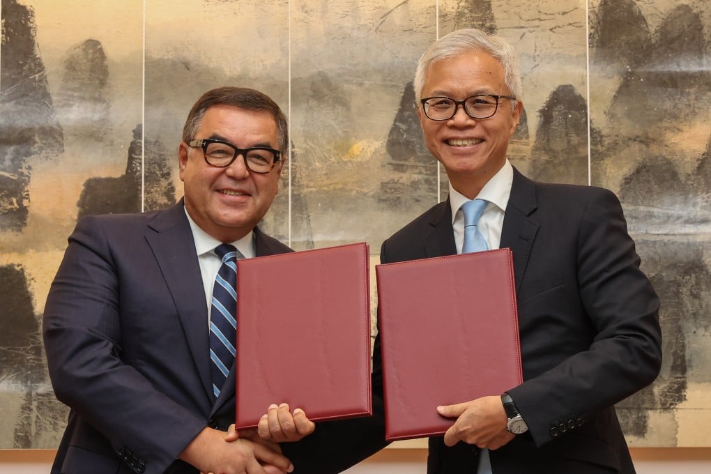 Firdavs Abdukhalikov (left), director of the Islamic Civilisation Centre, poses with Louis Ng, director of the Hong Kong Palace Museum. Photo: Edmond So