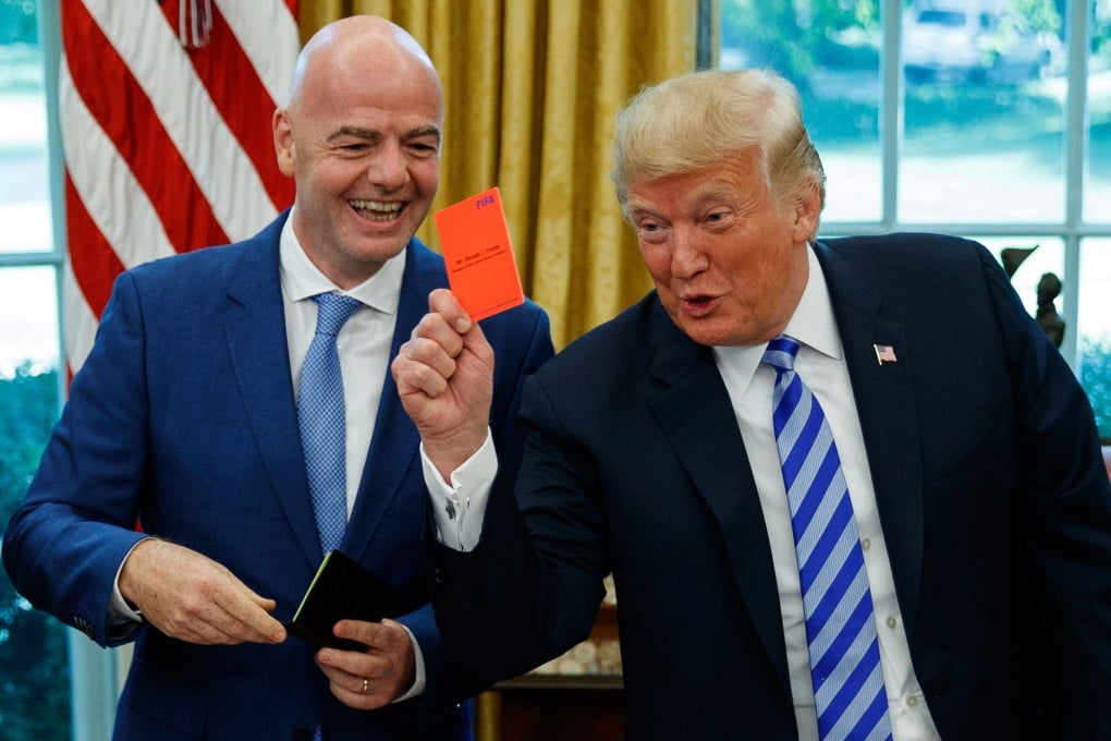 US President Donald Trump (right) holds up a red card during a meeting with Fifa president Gianni Infantino at the Oval Office in the White House in Washington in 2018. Photo:AP