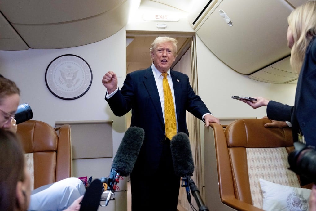 US President Donald Trump speaks to reporters in flight on Air Force One after landing at US Air Force Base at RAF Mildenhall, in Suffolk, England on July 8. Photo: AP