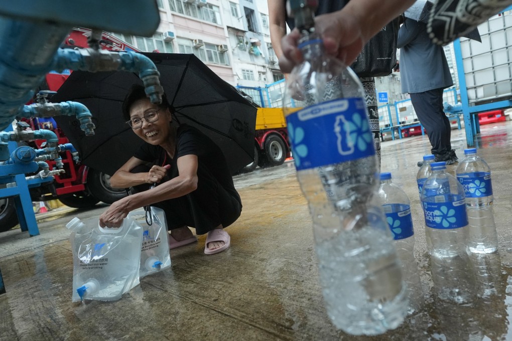 Residents line up to fill water bottles and buckets in Shau Kei Wan. Photo: Sun Yeung