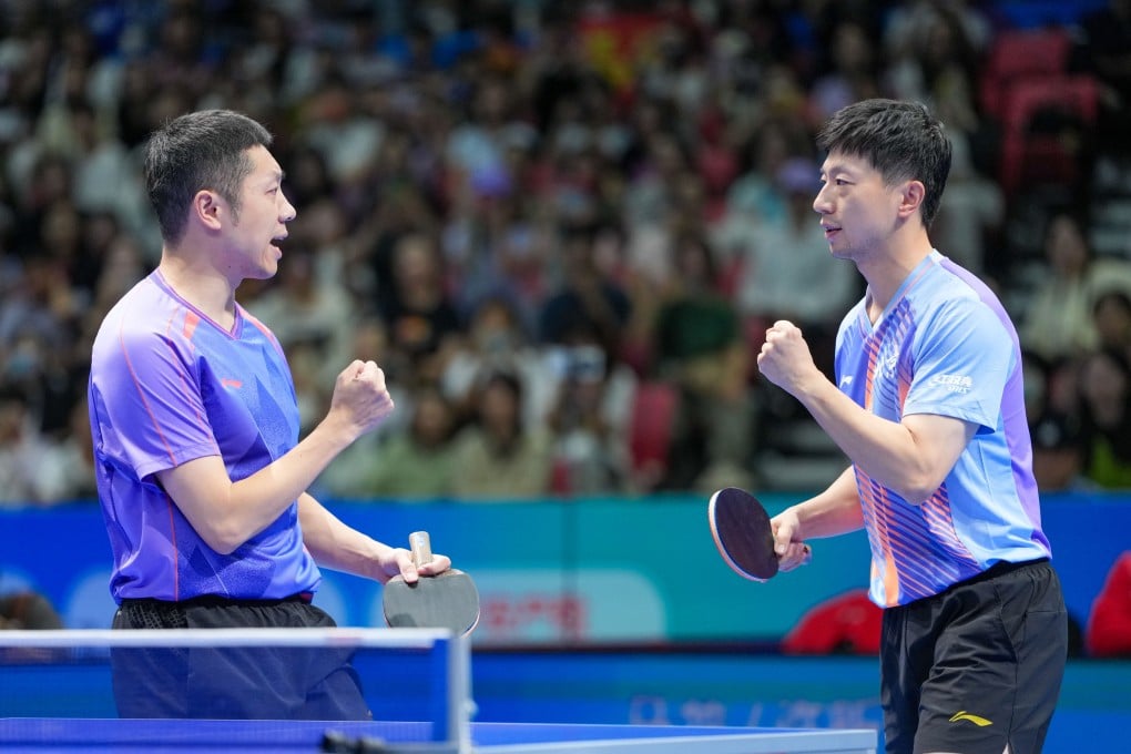 Ma Long (right) and Xu Xin won the men’s doubles title by defeating Xiang Peng and Huang Youzheng in straight games. Photo: Xinhua