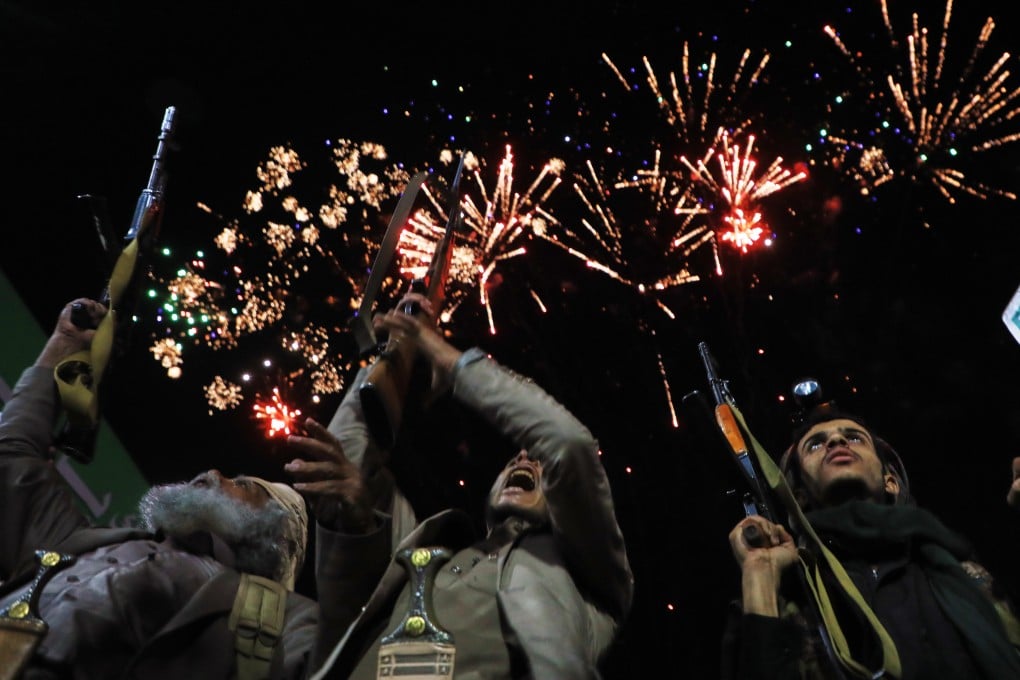 Fireworks burst as Houthi supporters rally against the Saudi-led coalition in Sanaa, Yemen, on Monday. Photo: AP