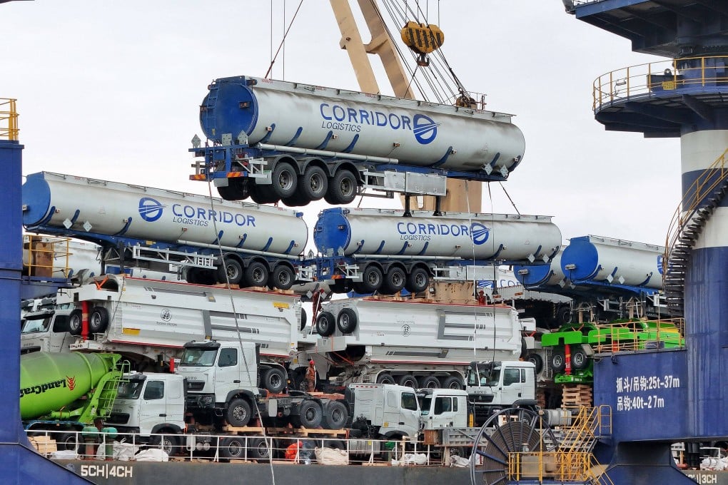 Fuel tankers are loaded onto a ship for export to Mali at the port in Yantai, in China’s eastern Shandong province on May 18. Photo: AFP