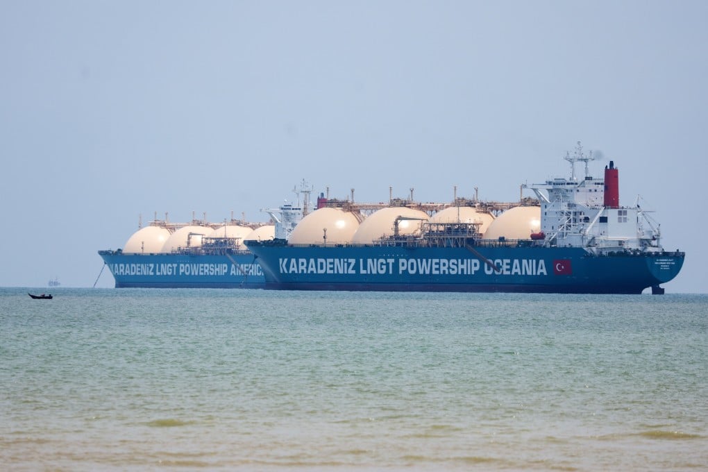 Two liquefied natural gas tankers and a fishing boat seen in the Strait of Malacca in April. Photo: EPA