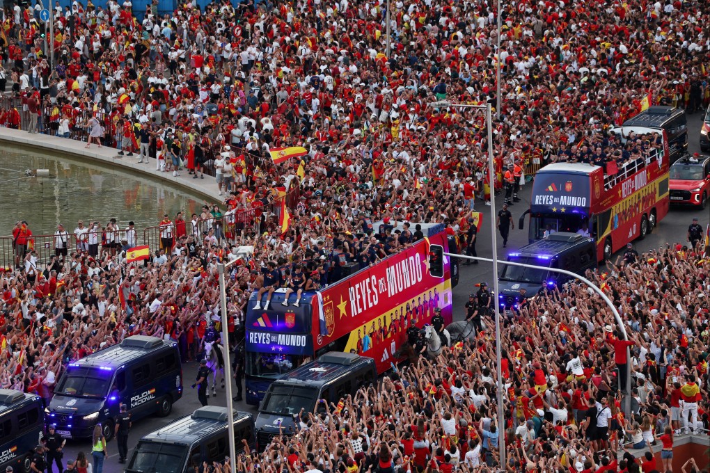 Spain players on buses during the World Cup victory parade through the streets of Madrid on Monday. Photo: Reuters