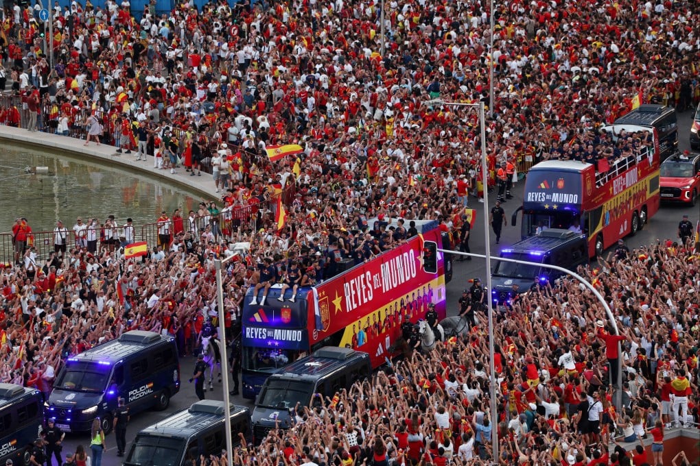 Spain players on buses during the World Cup victory parade through the streets of Madrid on Monday. Photo: Reuters