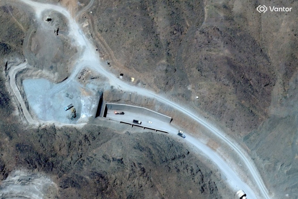 A satellite view shows vehicles at an entrance to Pickaxe Mountain tunnels, of the of the Natanz nuclear facility, near Natanz, Iran. Photo: Vantor via Reuters