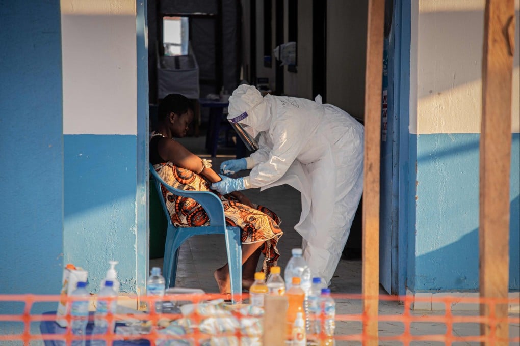A healthcare worker takes samples from a patient suffering from Ebola in Bunia, Ituri, in the Democratic Republic of Congo on June 23. Photo: AFP