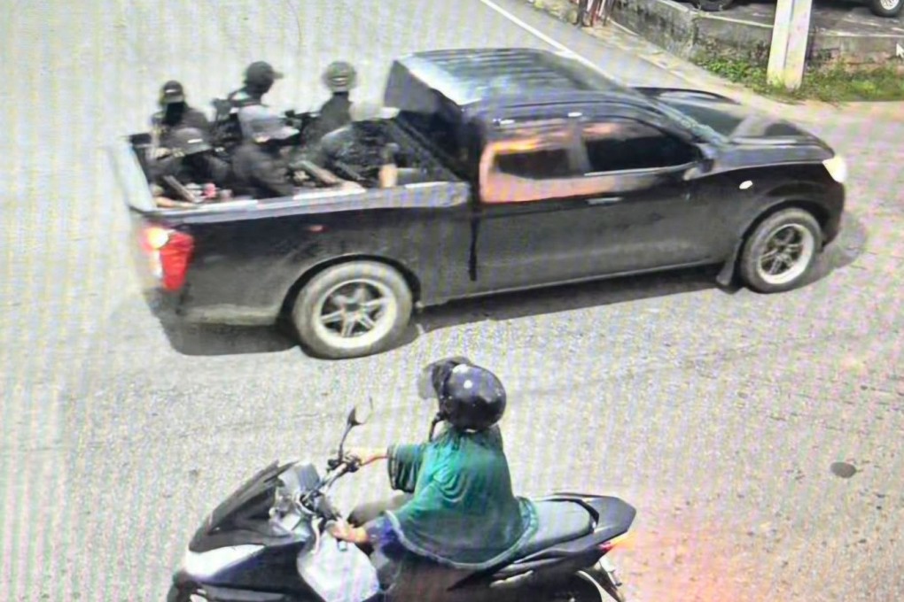 A group of men are seen in a video riding on a back of a black pickup truck before allegedly attacking  soldiers at a security checkpoint in Narathiwat province on Wednesday. Photo: Internal Security Operations Command Region 4/AP