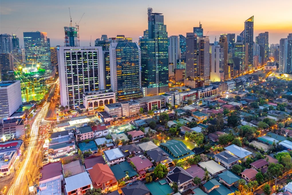 Makati, the business district of Metro Manila, lights up as night falls. Photo: Shutterstock