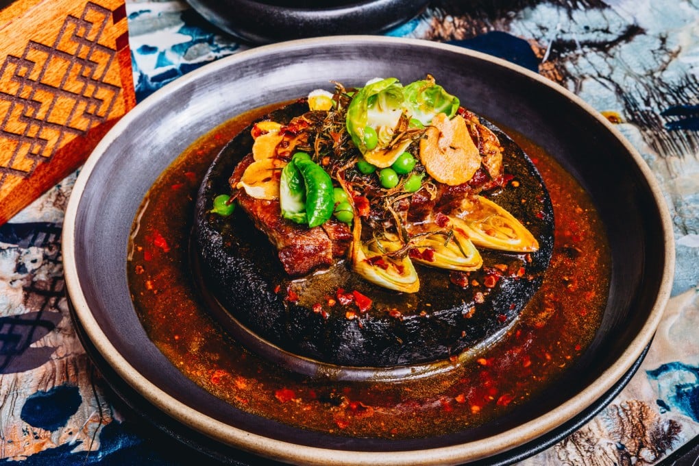 Japanese Kobe beef A5+ with grilled leeks and home-made black bean paste at Mott 32. Photo: Jocelyn Tam