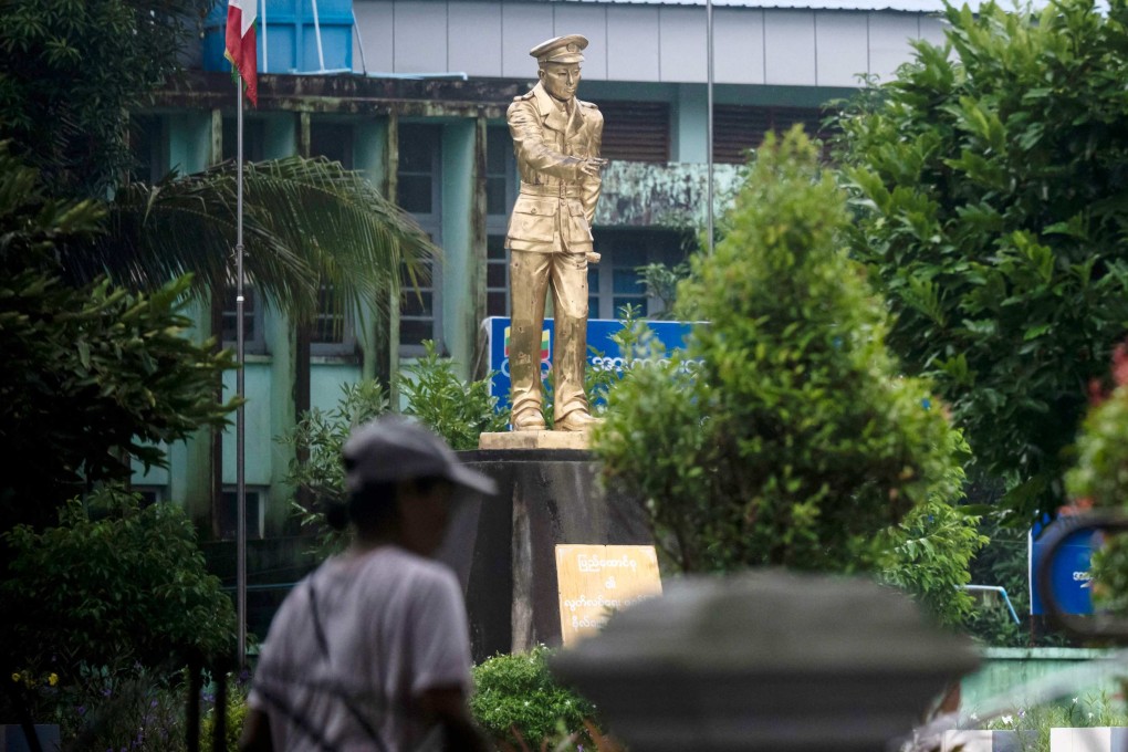 A woman walks past a statue of Myanmar’s independence hero Aung San at Thu Mingalar Park in Yangon on July 16. Photo: AFP