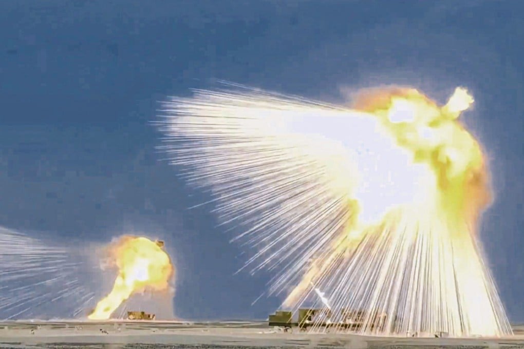 Footage from a PLA-affiliated social media channel on Sunday shows several PHL-191-launched rockets detonating above what appears to be a desert training range. Photo: Handout