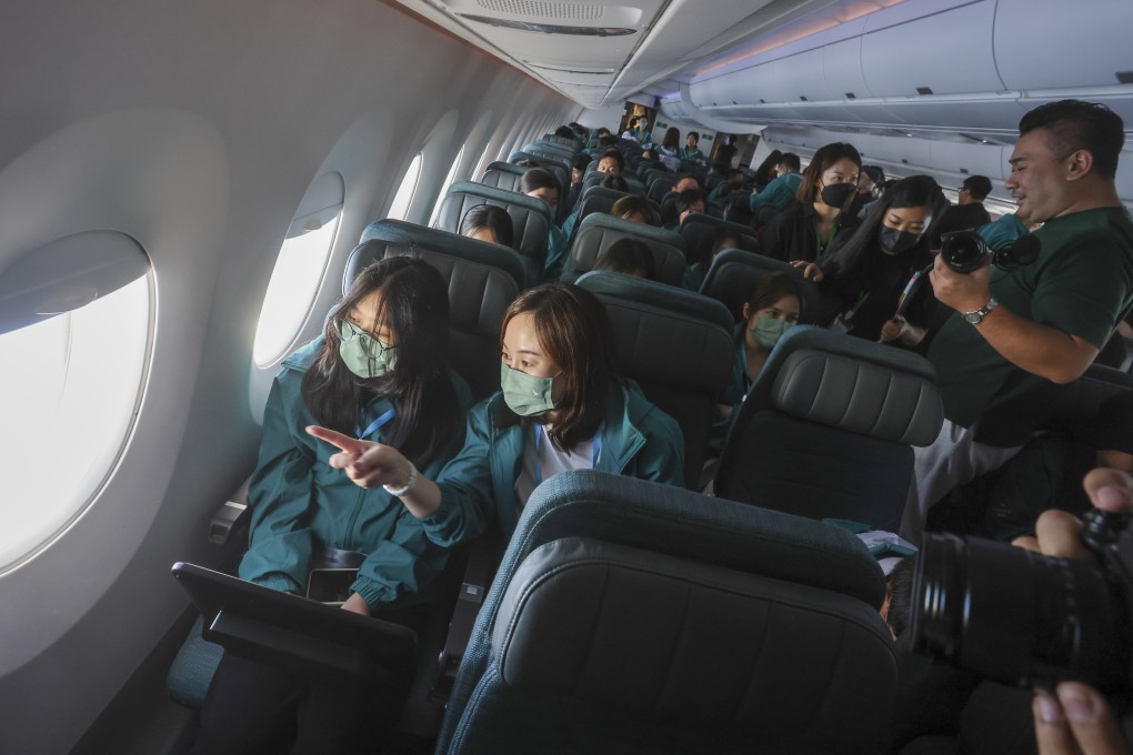 Dozens of students and their mentors took part in a Cathay Pacific community flight programme on May 21, 2023. Mentoring could begin simply, by matching adults with students or young employees and giving them a quiet place to talk. Photo: Jonathan Wong