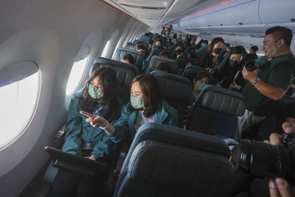 Dozens of students and their mentors took part in a Cathay Pacific community flight programme on May 21, 2023. Mentoring could begin simply, by matching adults with students or young employees and giving them a quiet place to talk. Photo: Jonathan Wong