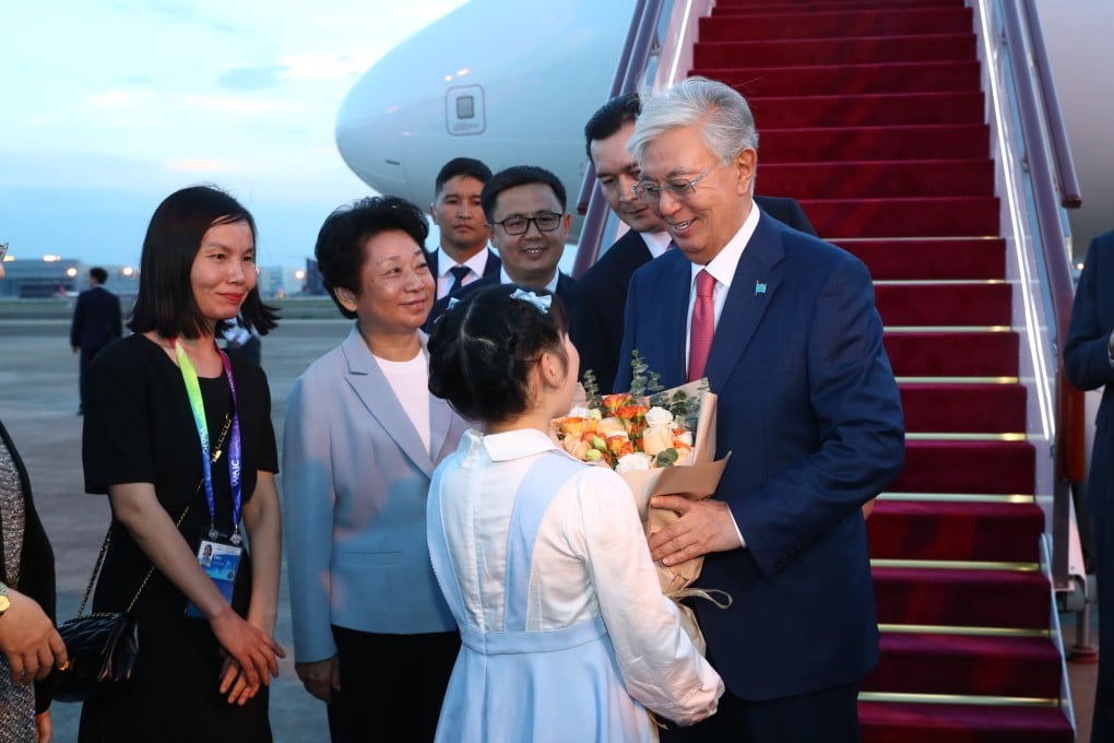 Kazakh President Kassym-Jomart Tokayev is greeted on his arrival in Shanghai on Jluy 15. Photo: Xinhua