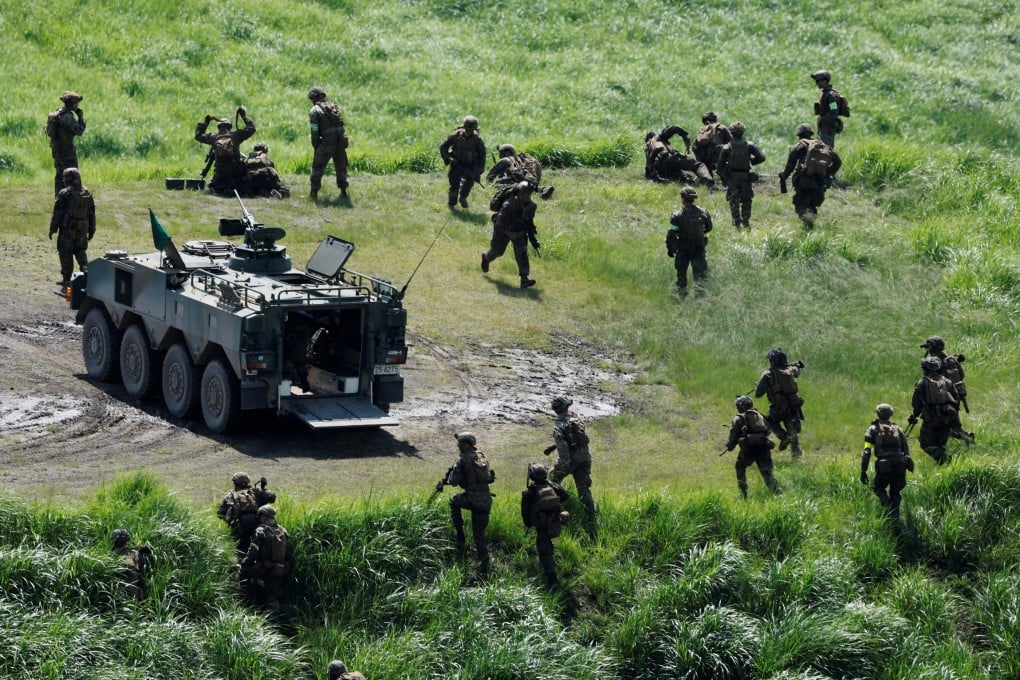 Members of the Japanese Self-Defence Forces and US Marines during a joint live-fire drill as part of the annual Resolute Dragon exercises in Yufu, Oita prefecture, Japan, on June 28. Photo: Reuters