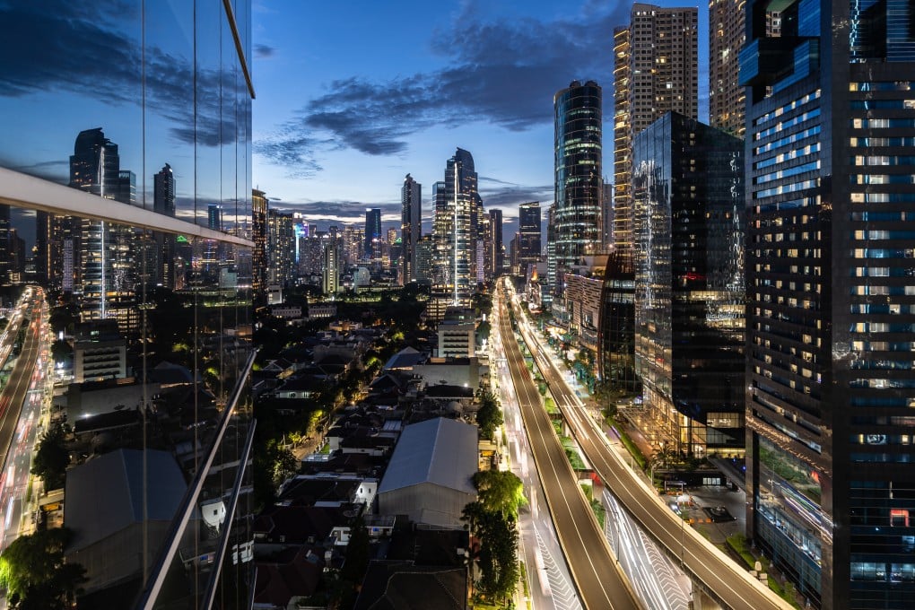 The sun sets over Kuningan business district in Jakarta. Indonesia wants to build a financial centre to rival Singapore, Hong Kong or Dubai. Photo: Shutterstock
