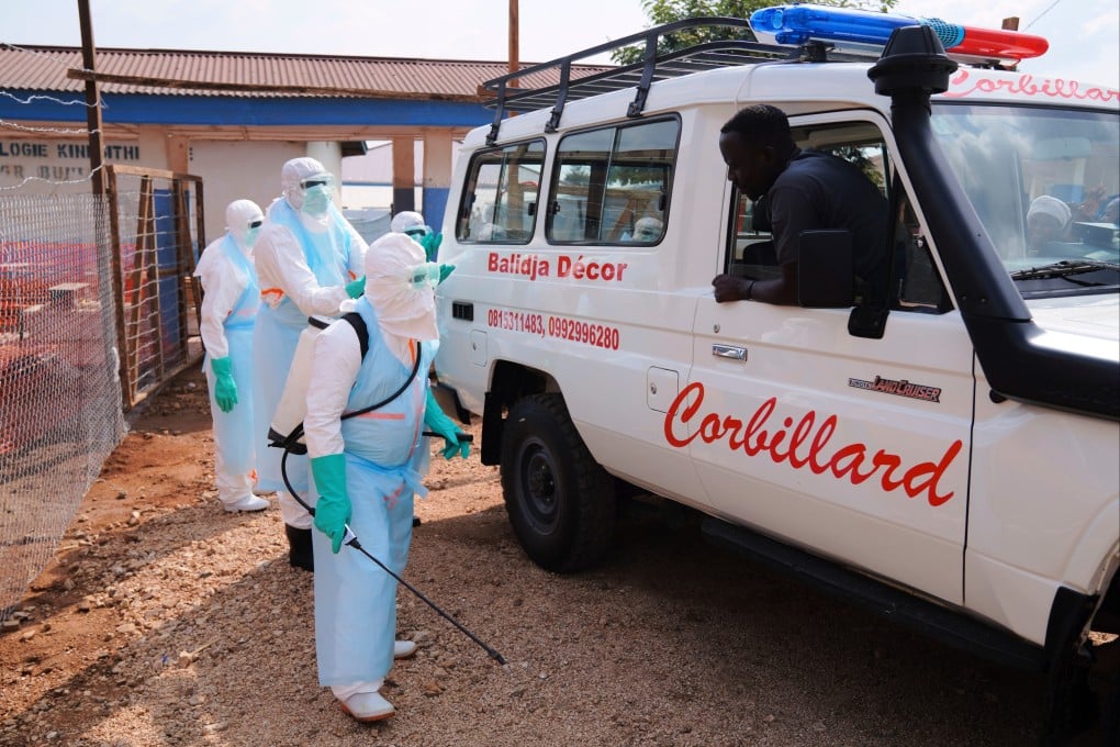 Health workers disinfect an ambulance in Ituri, Congo, on Wednesday. Photo: AP