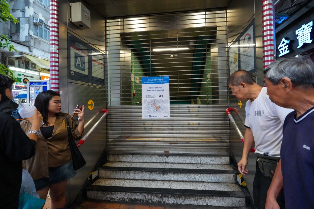 Flood barriers are up at an exit of the Sham Shui Po MTR Station after the Hong Kong Observatory issued a black rainstorm warning on June 18. Photo: Dickson Lee