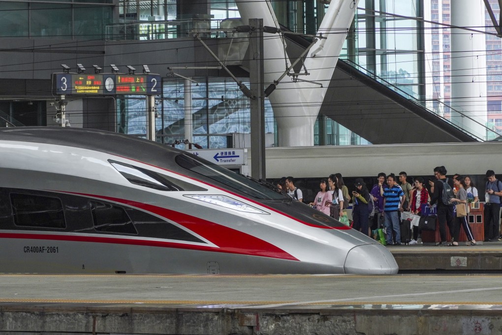 Travellers prepare to board a high-speed train at the Guangzhou South Railway Station. Photo: Roy Issa