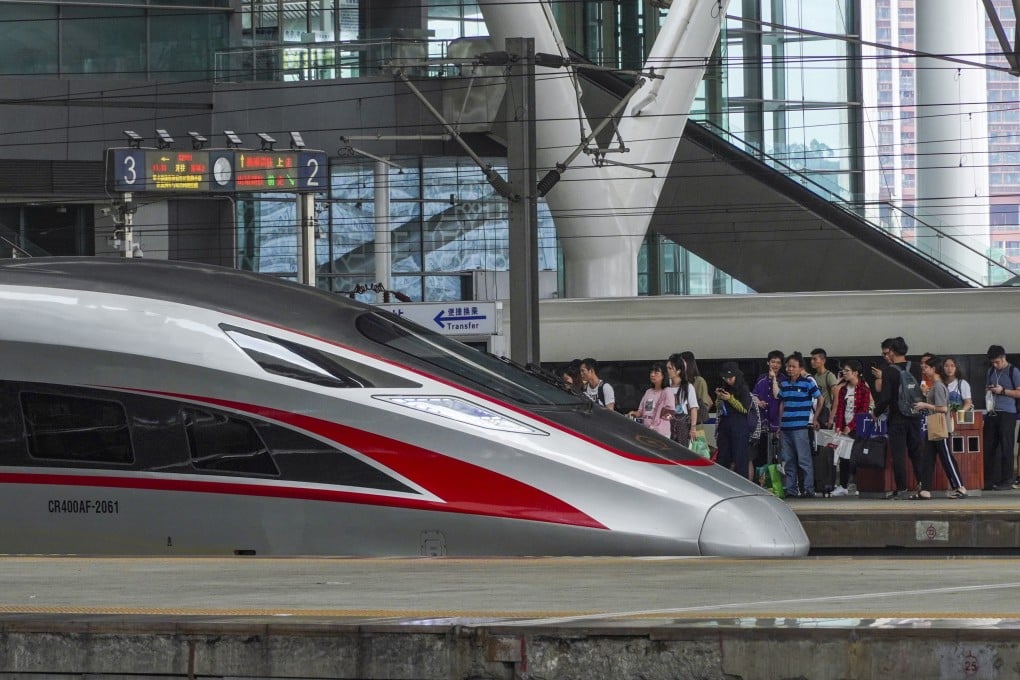 Travellers prepare to board a high-speed train at the Guangzhou South Railway Station. Photo: Roy Issa