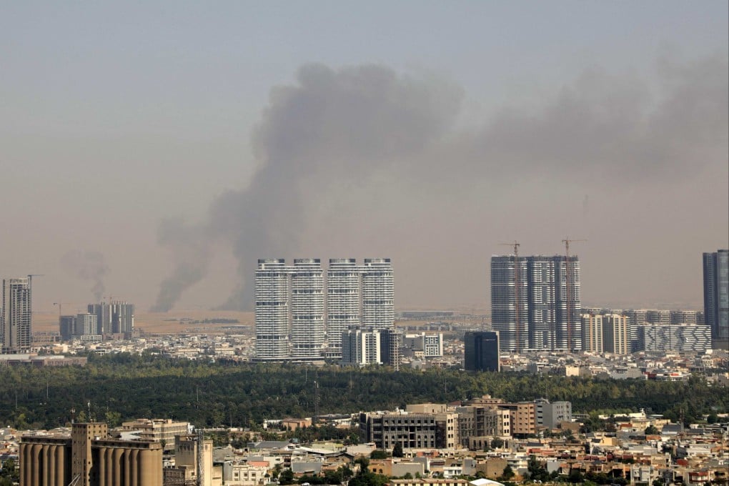 Smoke rises after explosions were heard near the airport in the city of Erbil, on Friday. The area hosts US-led coalition troops in Iraq’s semi-autonomous Kurdistan region. Photo: AFP