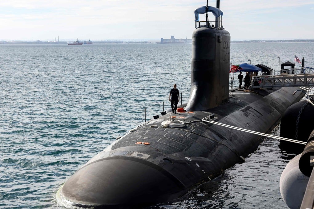 US Navy officers stand aboard the Virginia-class submarine USS Minnesota docked at HMAS Stirling in Rockingham, Western Australia, on February 26, 2025. Australia aims to acquire at least three US Virginia-class submarines. Photo: AFP