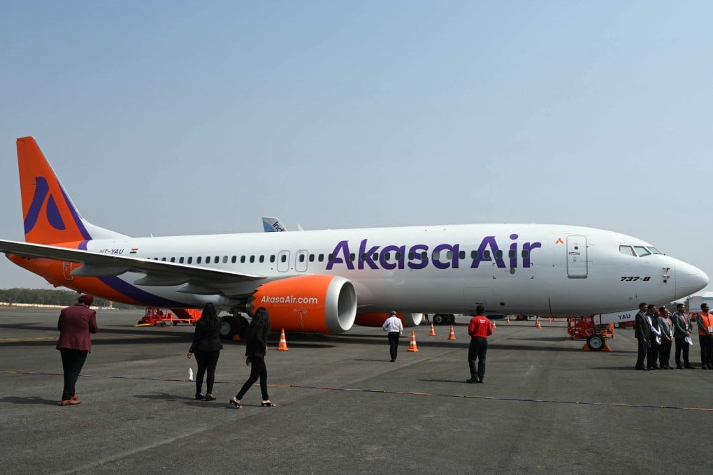 Visitors gathered near an Akasa Air aircraft at an aviation exhibition at the Begumpet Airport in Hyderabad in 2024. Photo: AFP