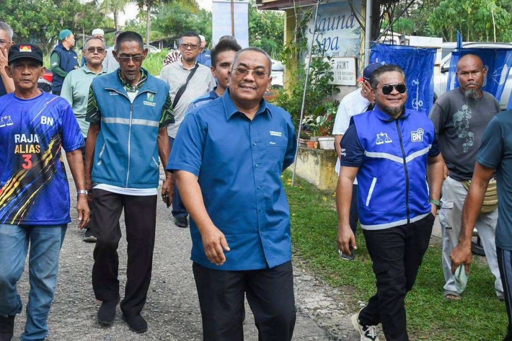 Muhammad Sanusi Md Nor (centre) campaigns with Perikatan Nasional supporters in Negeri Sembilan on Saturday. Photo: Facebook/N24MuhammadSanusiMdNor