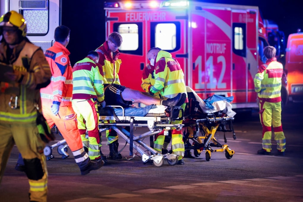 Emergency responders assist a person on a stretcher after a car crashed into the crowd at Berlin’sTiergarten park on Saturday. Photo: Reuters