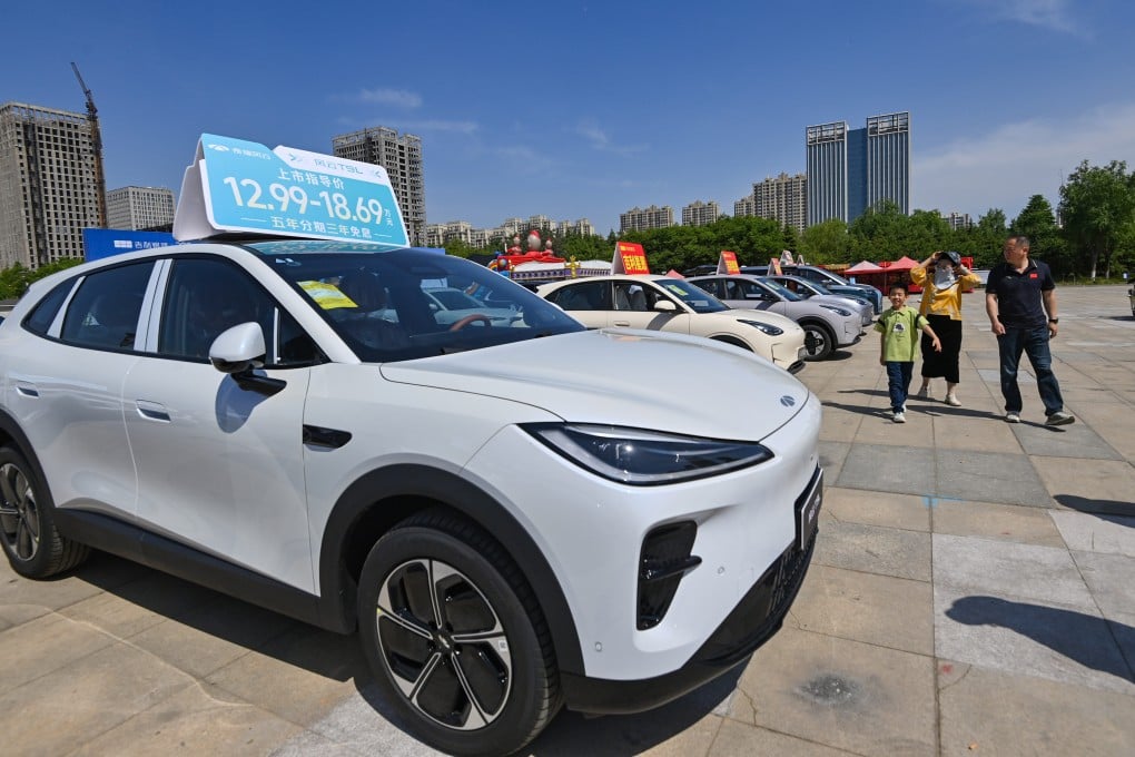 A family checks out cars for sale in Qingzhou, Shandong province, in May. Photo: CFOTO/Future Publishing via Getty Images